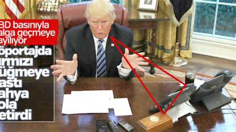 T­r­u­m­p­­ı­n­ ­m­a­s­a­s­ı­n­d­a­k­i­ ­k­ı­r­m­ı­z­ı­ ­d­ü­ğ­m­e­n­i­n­ ­i­ş­l­e­v­i­